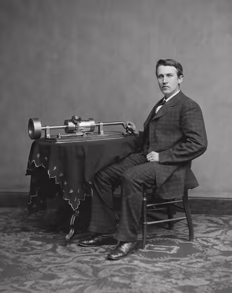 Thomas Edison with an early tinfoil phonograph, probably photographed in 1878. He filed his first phonograph patent application on December 24, 1877.