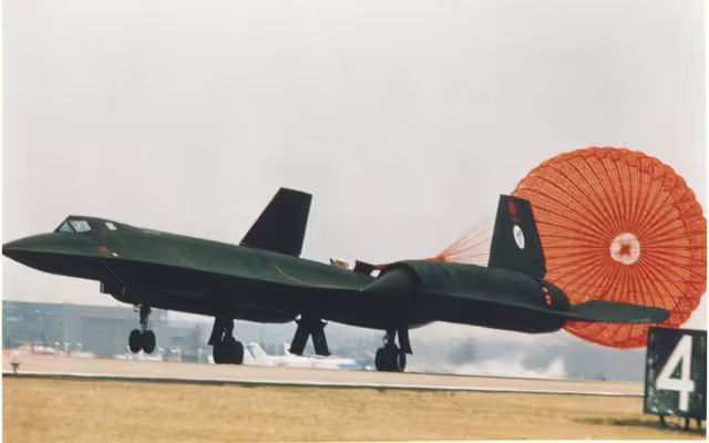 Lockheed SR-71A Blackbird 61-7972, the aircraft that set the New York-to-London speed record in 1974, landing with its drag chute deployed.