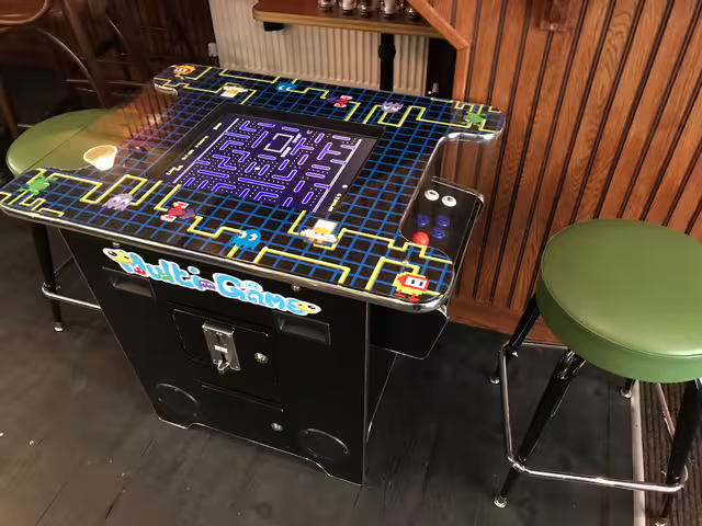 A cocktail-style Pac-Man arcade machine, photographed in 2019. The original game made its public debut in Japan on May 22, 1980.