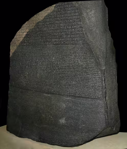 The Rosetta Stone at the British Museum, London. Its inscriptions in hieroglyphic, Demotic and Greek scripts provided a crucial key to deciphering ancient Egyptian writing.